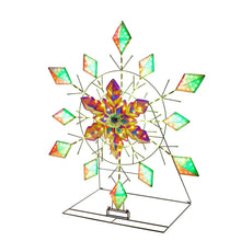 Color-changing pre-lit snowflake decoration with green and orange LED glow on wire frame