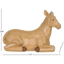Wooden nativity ox figurine with tan finish, standing on straw base
