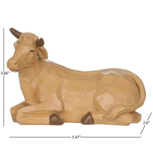 Wooden nativity cow figurine on carved base