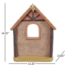 Wooden nativity stable house with arched doorway and star roof topper