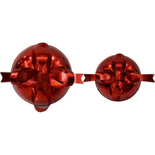 Oversized red jingle bell décor set of 2 with large ribbon bows, top view