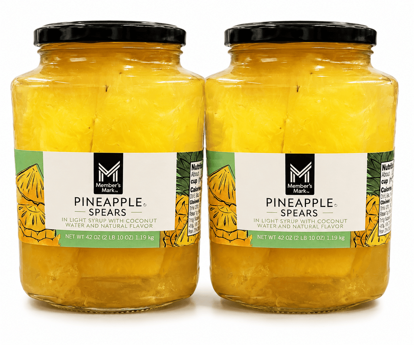Two jars of pineapple spears in coconut water, black lids, yellow contents