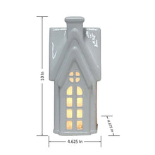 Pre-lit white holiday house with warm window lights; 10 in height