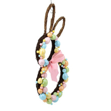 Bunny-shaped twig wreath with pink bow and pastel bead accents, front view