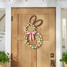 Twig bunny-shaped wreath with multicolor bead garland and pink ribbon bow
