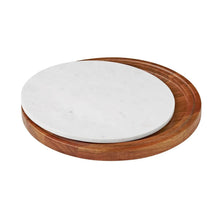 Wood-and-marble lazy susan with white marble top and dark wood base, isolated