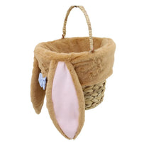 Woven bunny Easter basket with tan plush ears, pink bow sash, and woven wicker body
