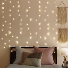 Warm white LED curtain string lights with cascading bulbs for indoor decoration