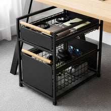 Black two-tier organizer with pull-out baskets storing desk accessories
