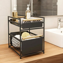 Black two-tier organizer holding towels and bath items