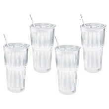 Four ribbed glass cups with clear straws, matching set