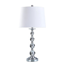 Standing lamp with white fabric drum shade and chrome beaded column base.