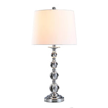 Standing lamp with light fabric drum shade and chrome beaded column base.