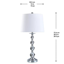 Table lamp with white fabric drum shade and chrome beaded column base.
