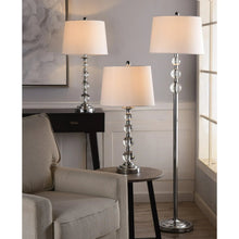 Set of three standing lamps with chrome bases and white fabric drum shades.