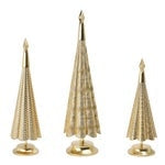 Three gold-tone metal holiday trees with tapered shapes and round bases