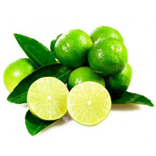 Key limes and sliced lime with green leaves