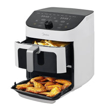 White dual basket air fryer oven with baskets filled with roasted food