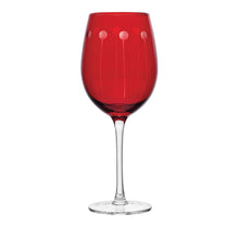 Ruby red wine glass with small dot accents on the bowl