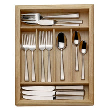 Stainless steel flatware set in open wood caddy, forks, spoons, and serving utensils