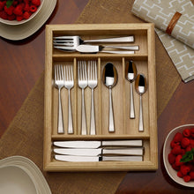 Stainless steel flatware set in wood caddy, forks, spoons, and knives