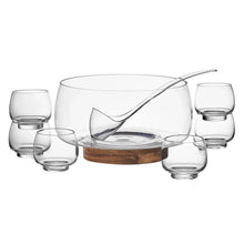 Glass punch bowl set with ladle and multiple small clear cups