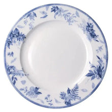 Blue-and-white floral dinner plate with scalloped rim detail