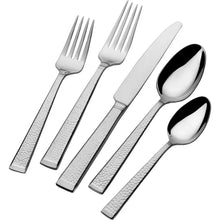Stainless steel flatware set with forks, knives, and teaspoons, polished mirror finish