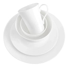Stacked white bone china bowls with a cup and saucer-like plate