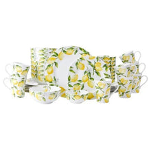 Lemon-themed white dinnerware set with yellow lemons and green leaves, plates and cups