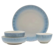 Set of blue and white bowls and a large dinner plate with speckled glaze