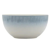 Blue and white ceramic dinner bowl with textured speckled glaze