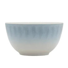 Blue and white ceramic dinner bowl with speckled glaze finish