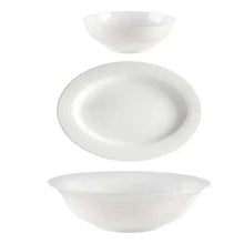 Set of three white serving bowls and plates with raised textured pattern.