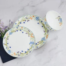 Floral bone china dinner plate and small bowl, with botanical rim