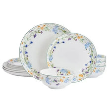 Floral bone china dinner plate set with stack of plates and bowl