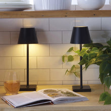 Set of 2 LED lamps, black shades and square bases, standing on a tabletop