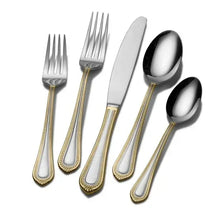 Stainless steel cutlery pieces with gold bead trim, forks, spoon, and knife set