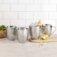 Set of 4 hammered stainless steel mugs with handles, with citrus garnish