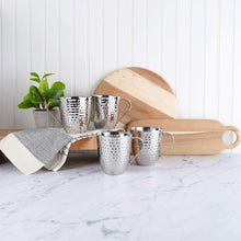 Set of 4 double-wall hammered stainless steel mugs with curved handles