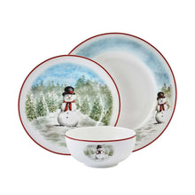 Snowman dinnerware set with stacked plates and a bowl, all with red trim and snowy trees