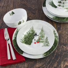 Mikasa Snowman winter dinnerware set with plates and bowls decorated with snowy trees and a snowman