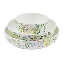 Stacked round bone china bowls, white with multicolor garden floral border