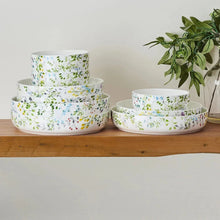 Bone china bowl set, white with multicolor garden floral print, stack of round bowls