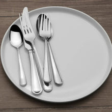 Stainless steel flatware set with forks, spoons, and knife