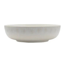 Round white dinnerware bowl with shallow rim and smooth exterior