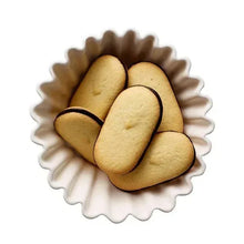 Oval cookies with dark chocolate borders stacked on a paper tray