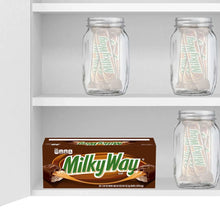 Chocolate candy display with Milky Way box and clear jars