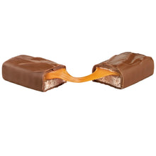 Chocolate candy bar with caramel filling, broken open