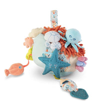 Plush ocean sensory activity toy with blue starfish and orange textured tentacles